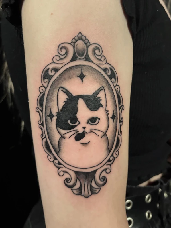 Cat portrait in a mirror frame, tattooed by Cara