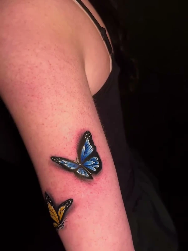 Blue butterflies, tattooed by Jordan