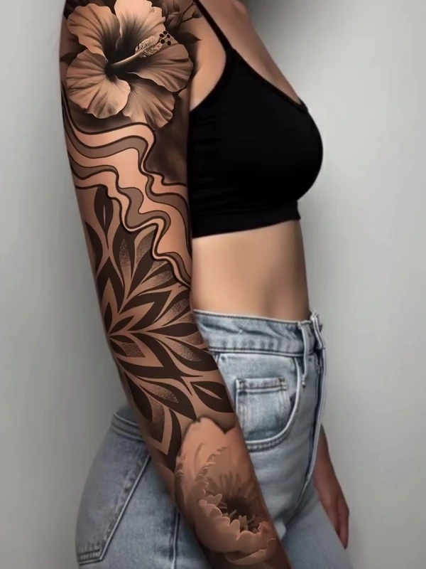 Black and grey floral full sleeve, tattooed by Jordan